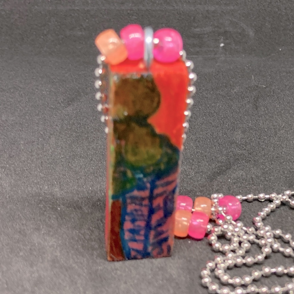 Wood block necklace with tree and house drawing